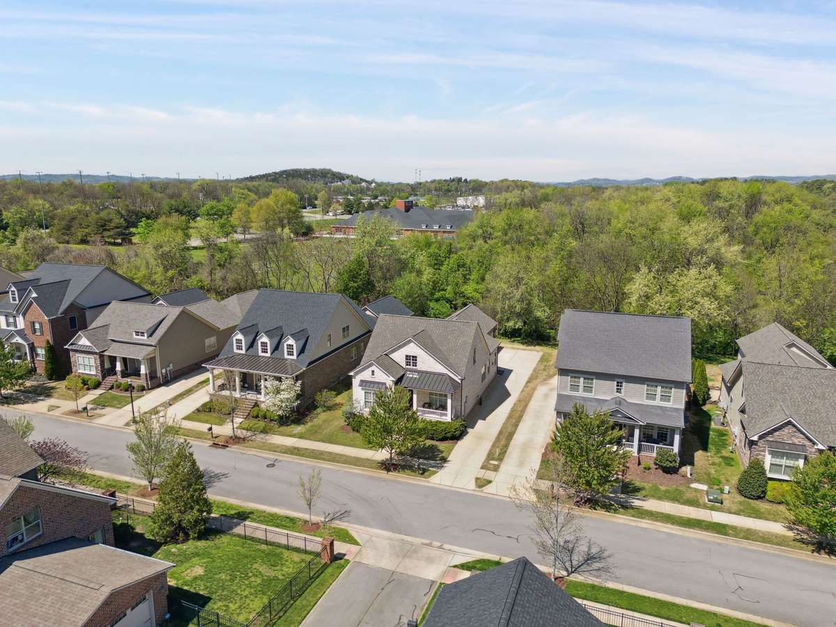 Wooded land behind this property give you that privacy feel.