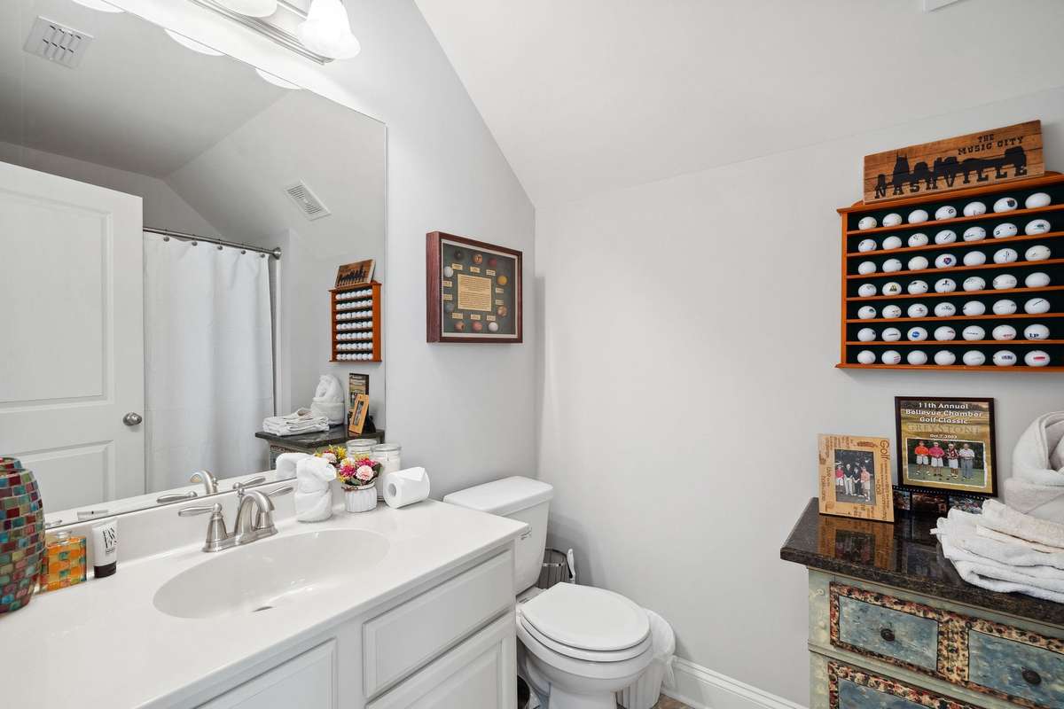 Upstairs full bathroom featuring shower/tub combination great for your guests use not to have to go downstairs.