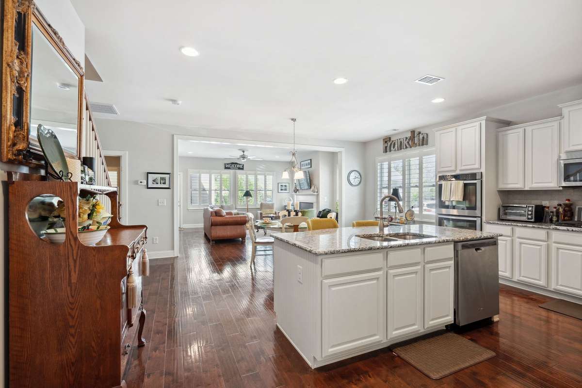 Just past the foyer area you enter this open concept home beginning with the kitchen.