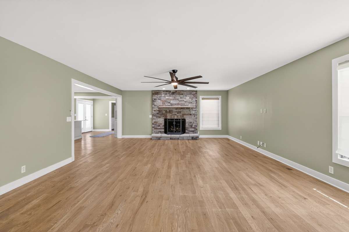 LARGE FAMILY ROOM WITH STONE FIREPLACE