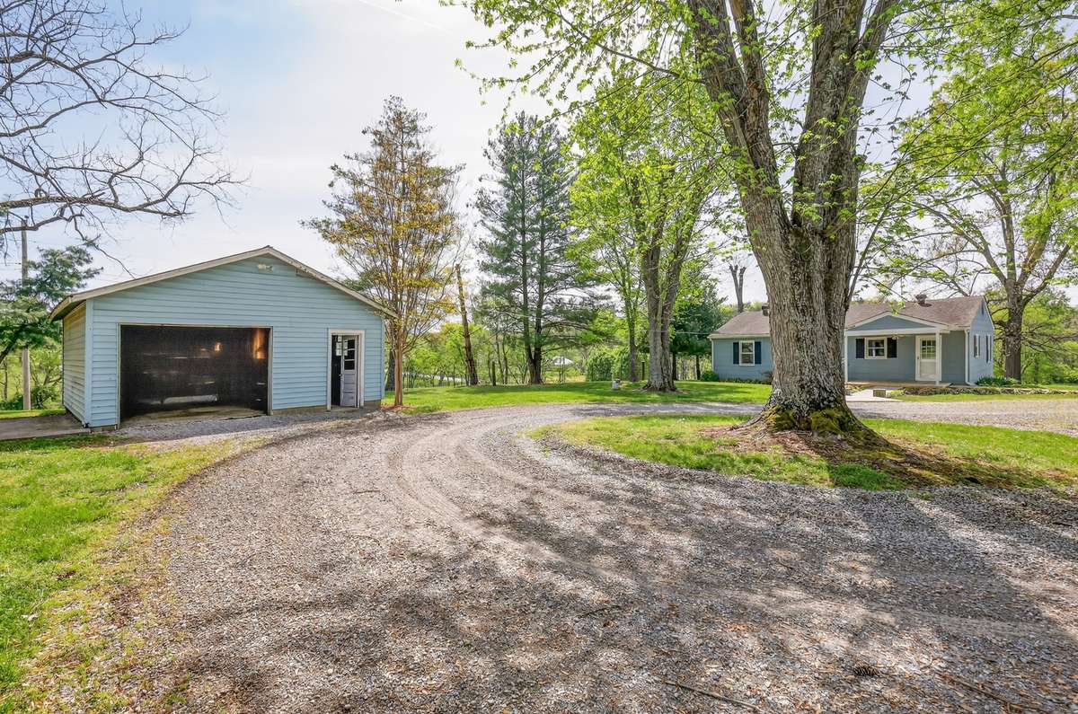 Guest House has its' own garage and workshop.