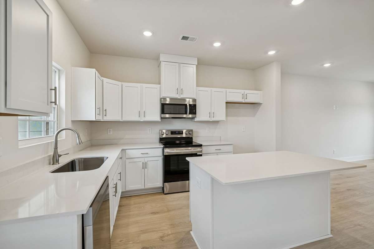 Photo is similar home in the same community - 2&3 bedroom options - MOVE IN READY - - upgrades available. Model home open Wed-Sat 10-5 & Sun 1-5. Dog Park and Playground as amenities.