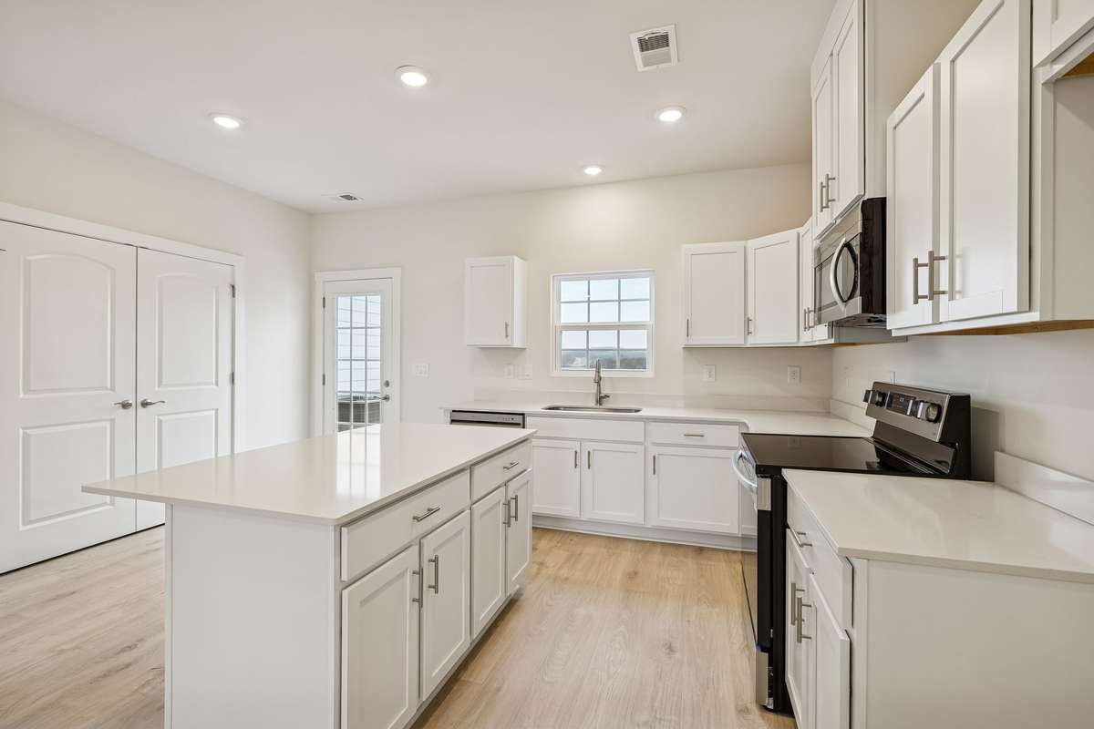 Photo is similar home in the same community - 2&3 bedroom options - MOVE IN READY - - upgrades available. Model home open Wed-Sat 10-5 & Sun 1-5. Dog Park and Playground as amenities.