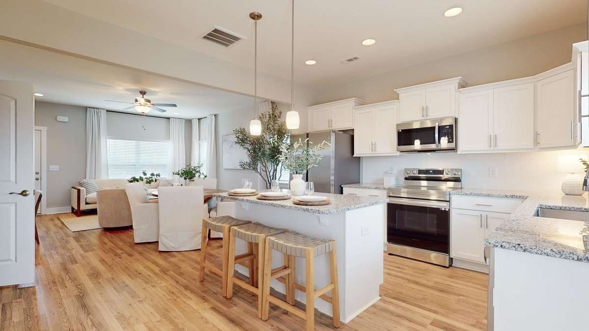 Photo is similar home in the same community - 2&3 bedroom options - MOVE IN READY - - upgrades available. Model home open Wed-Sat 10-5 & Sun 1-5. Dog Park and Playground as amenities.