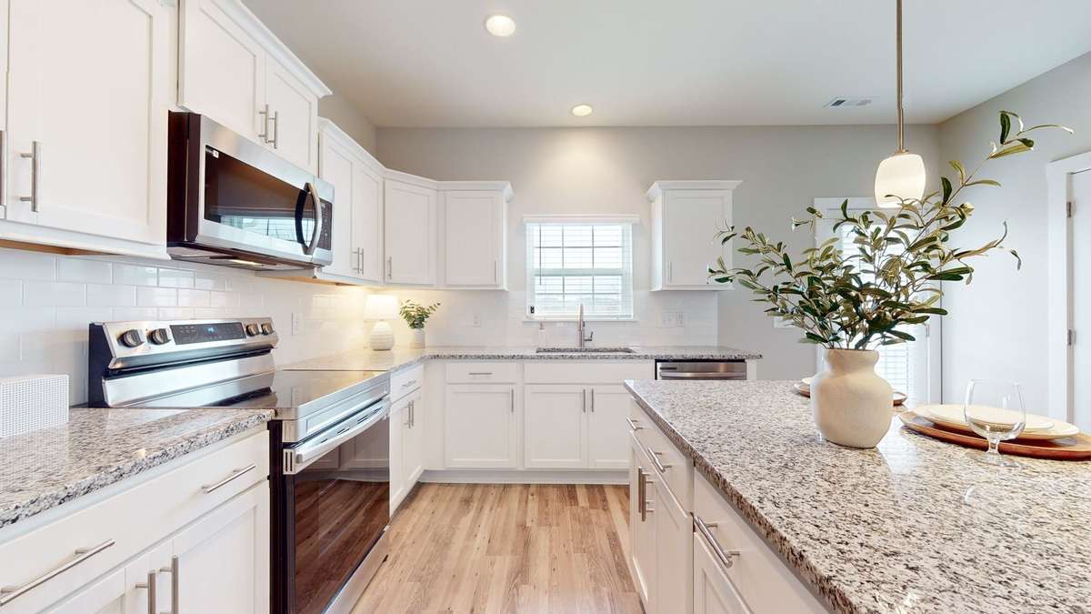 Photo is similar home in the same community - 2&3 bedroom options - MOVE IN READY - - upgrades available. Model home open Wed-Sat 10-5 & Sun 1-5. Dog Park and Playground as amenities.