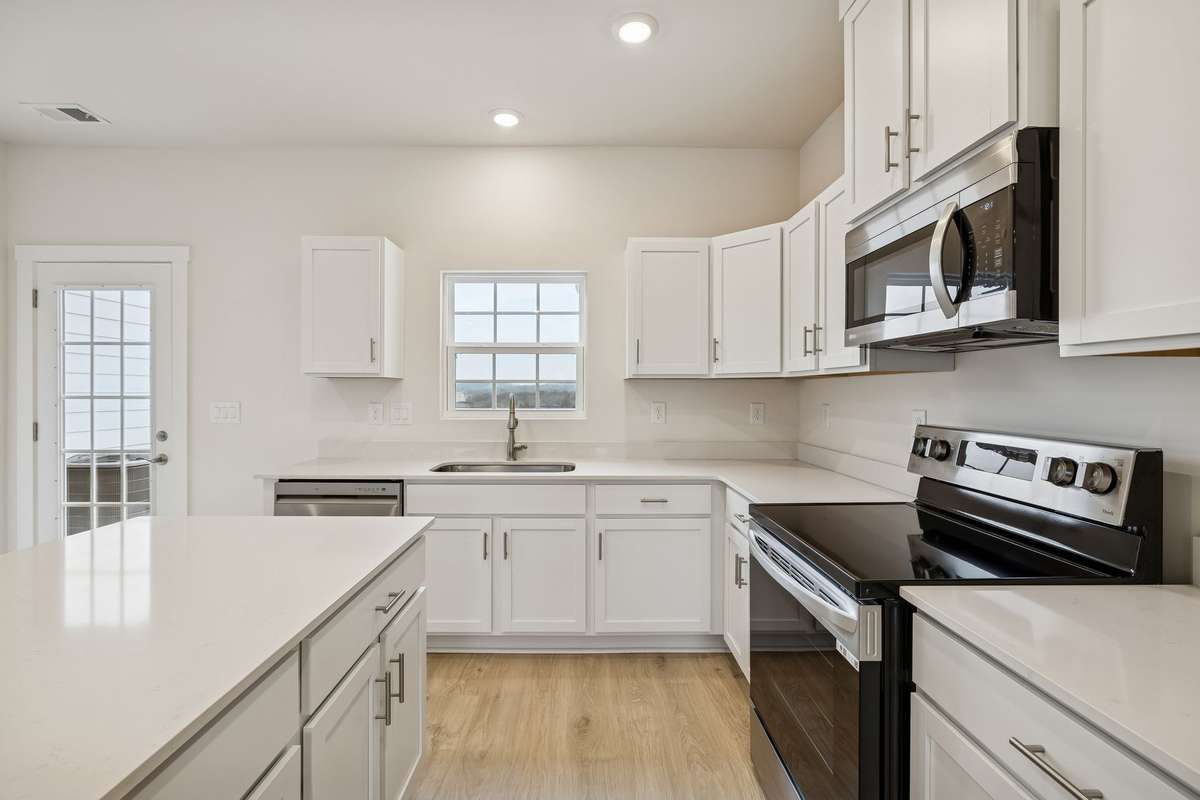 Photo is similar home in the same community - 2&3 bedroom options - MOVE IN READY - - upgrades available. Model home open Wed-Sat 10-5 & Sun 1-5. Dog Park and Playground as amenities.