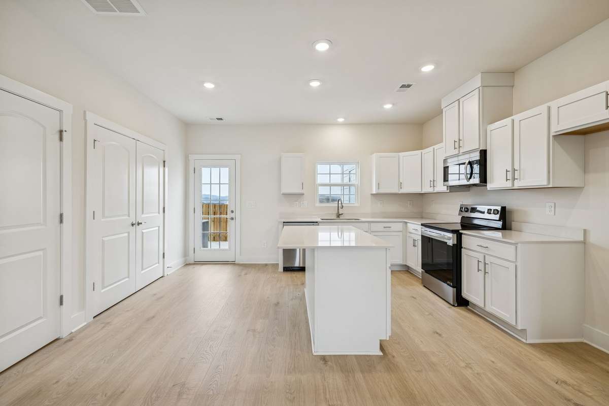 Photo is similar home in the same community - 2&3 bedroom options - MOVE IN READY - - upgrades available. Model home open Wed-Sat 10-5 & Sun 1-5. Dog Park and Playground as amenities.