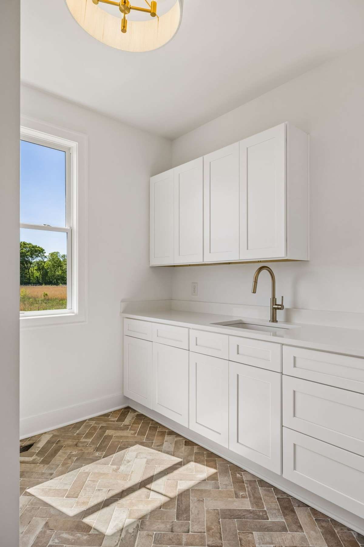 Look At This Utility Room  Gorgeous Tile Floor and Plenty Of Cabinets and Counter Space