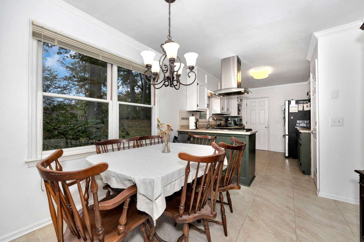 Dining Room- tile flooring, crown molding
