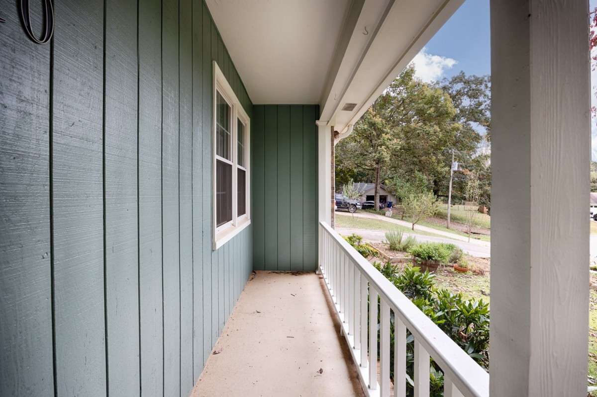 Covered front porch with railing