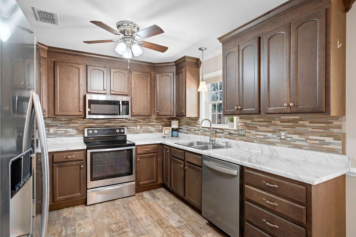 Stylish mosaic tile backsplash and marble-look countertops!