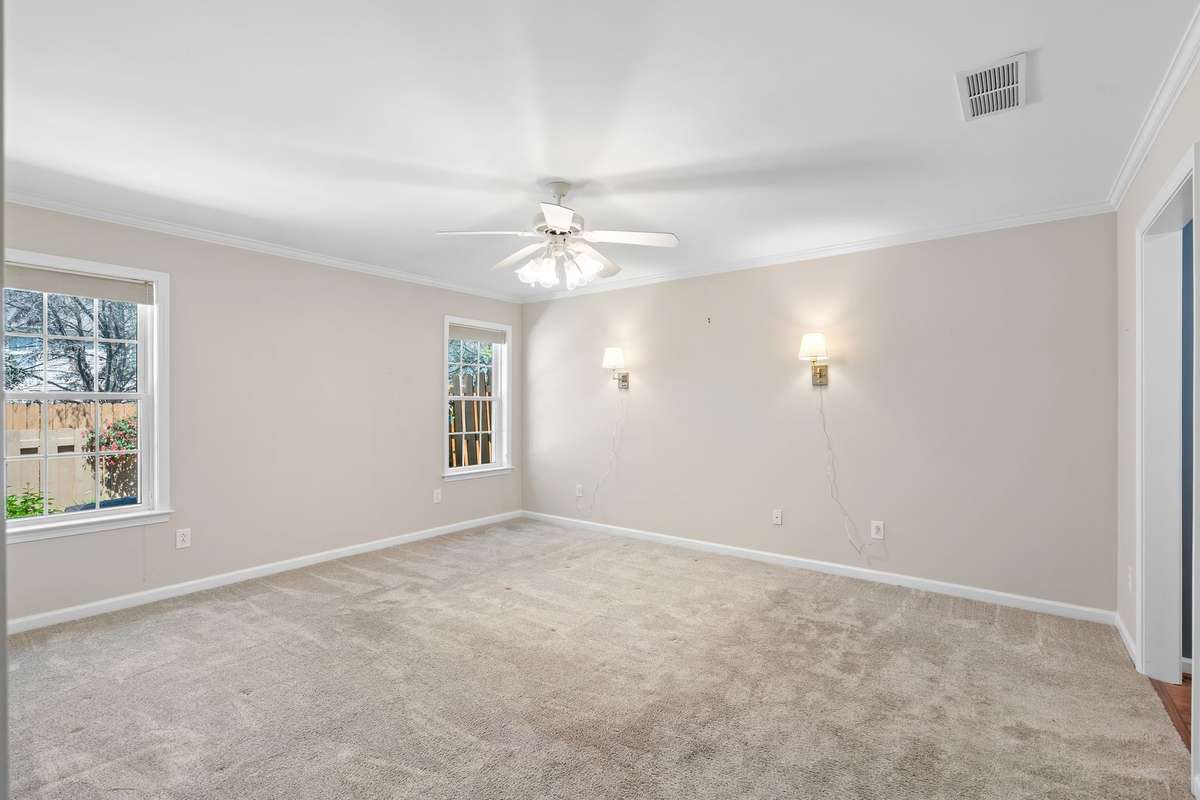 HUGE primary suite with plush carpet and a designer tray ceiling!