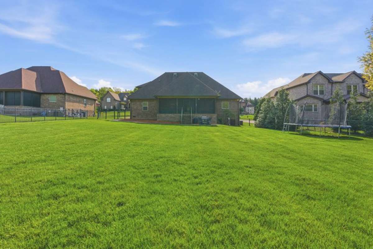 The whole yard irrigation system keeps this yard looking lush. The large screened porch will be your favorite spot to spend time in the private view.