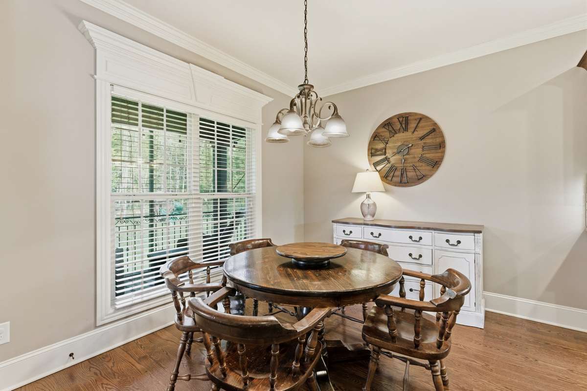 There is an eat-in area in the kitchen that overlooks the backyard and opens to the screened back porch.