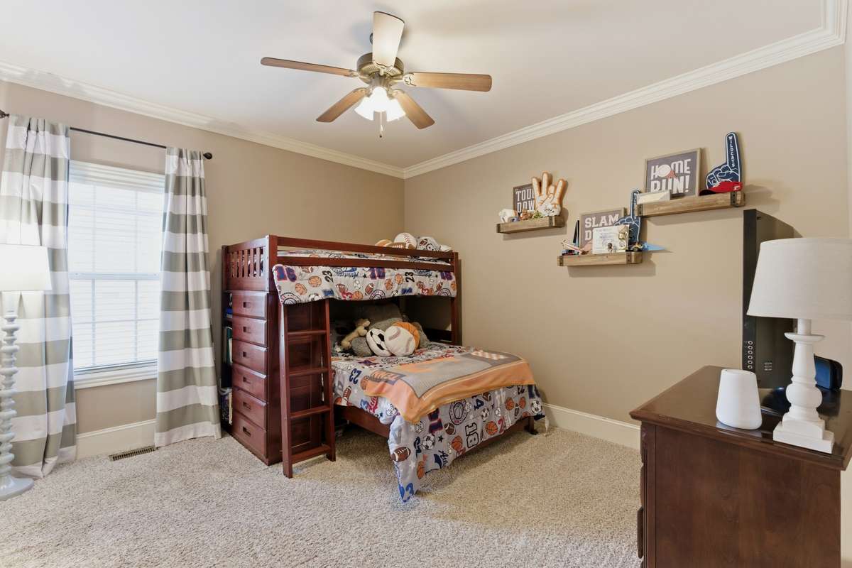 Bedroom 3 is on the main level & connects to a full bath shared with bedroom 2.