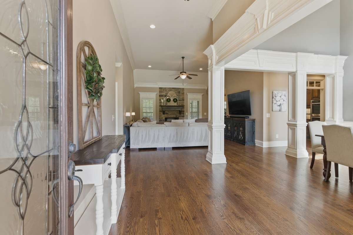 The large foyer area opens to the dining and great room.