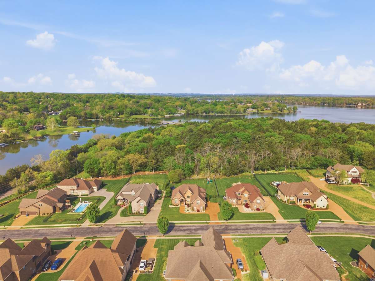 This home backs to the private wooded area and has a level lot & fenced backyard.