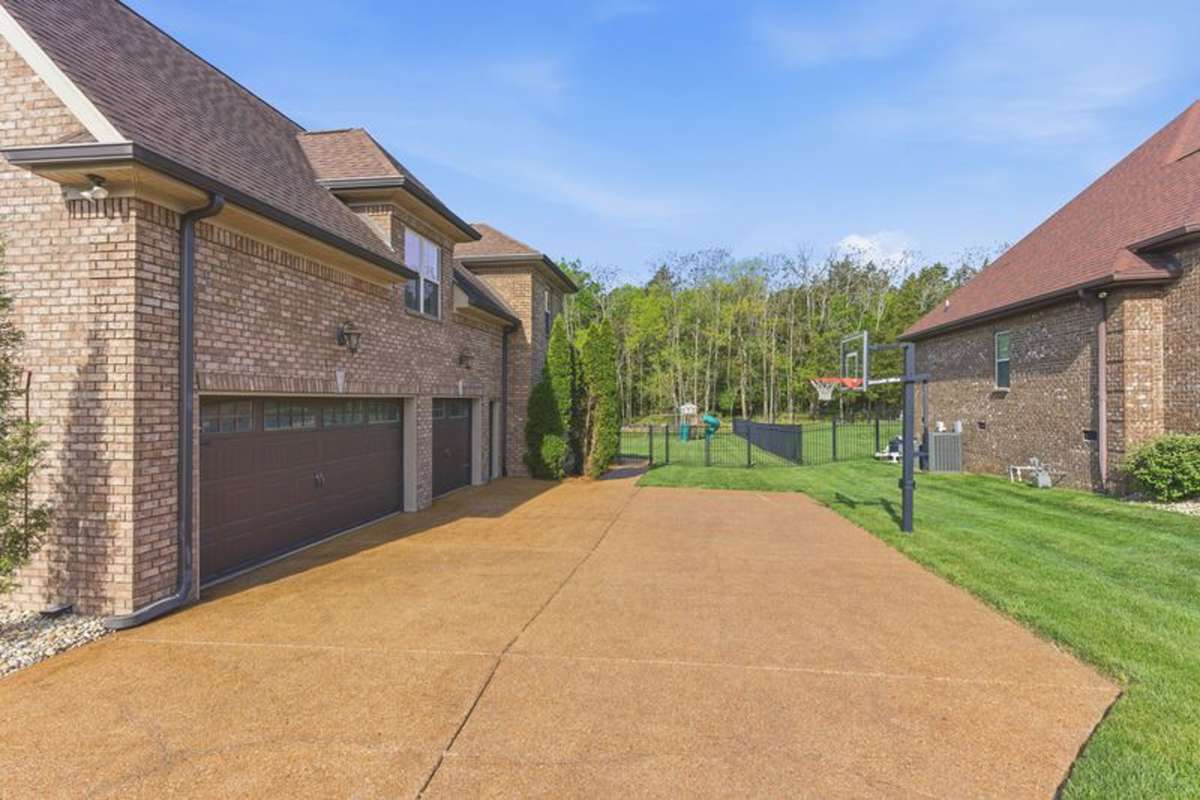 The 3-car attached garage allows plenty of room for your cars and toys, and the driveway is level & wide for company.