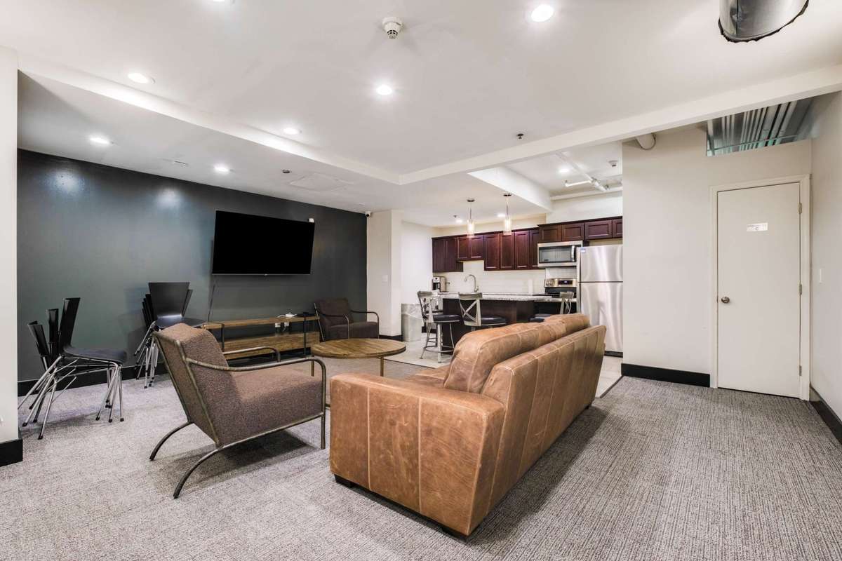 The owners lounge features a TV viewing area and a separate kitchen, perfect for additional entertaining or meetings right within the Bennie Dillon.