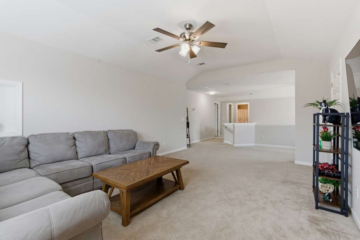 Expansive Bonus Room perfect for theatre, home office or both