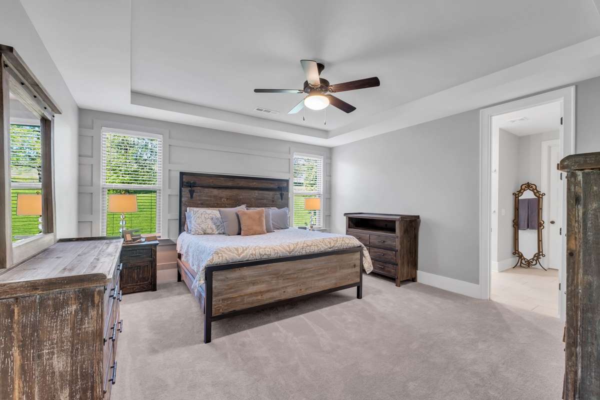 Spacious primary bedroom on main level.