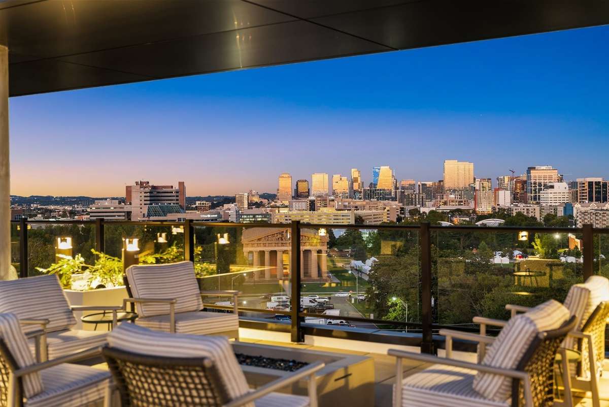 Rooftop with outdoor grill, firepit, and unparalleled panoramic views of downtown Nashville and the Parthenon building.
