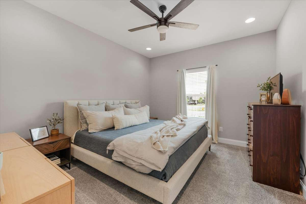 Guest room downstairs, no closet so other uses could include office, home gym, playroom.