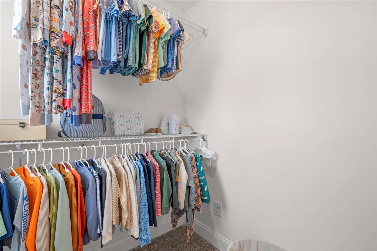 Roomy walk in closet in this secondary bedroom
