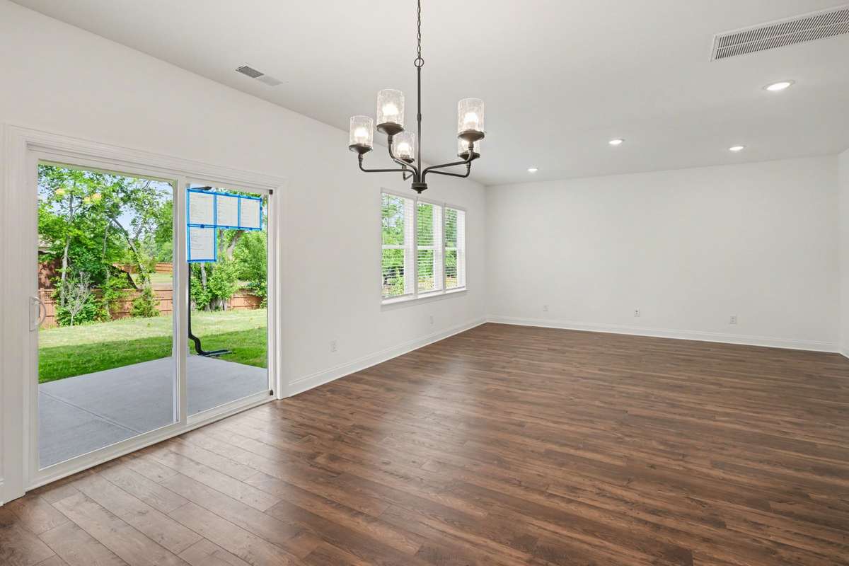 Bright Breakfast area, leading out to your covered patio and luscious backyard.