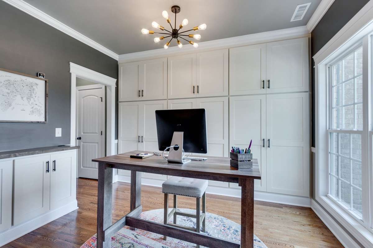 flex room with custom built in's. left cabinet is a hidden drop zone with hooks and cubbies