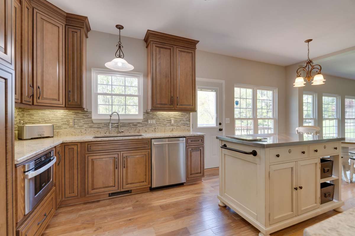 Kitchen leads to deck and back yard