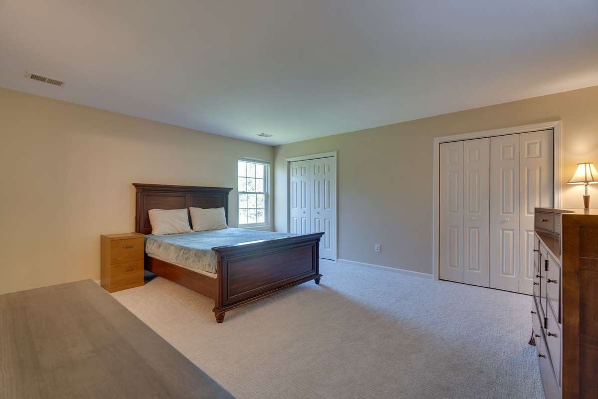 Fourth upstairs bedroom has ensuite bath.  Well suited for additional primary suite, teen room or maybe even the in-laws!