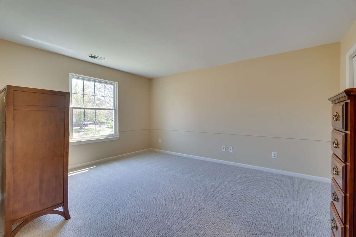 One of three additional bedrooms upstairs.  This room is connected to 3rd bedroom by dual use bathroom