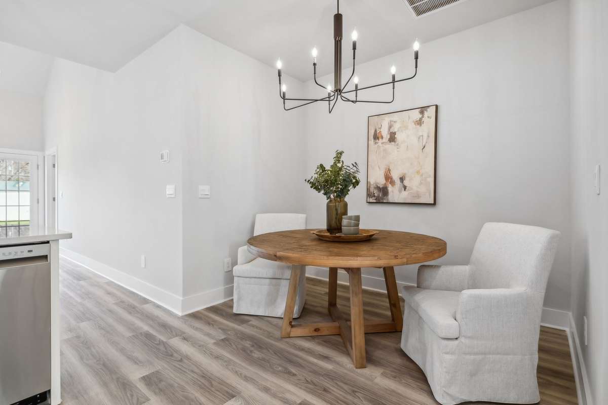 Photo of similar home in the same community - primary on the main level with one car garage. Upgrades available. Closing cost assistance available. Contact the onsite agent - model home open Wednesday-Saturday 10-5 and Sunday 1-5.
