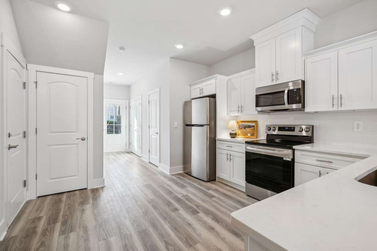 Photo of similar home in the same community - primary on the main level with one car garage. Upgrades available. Closing cost assistance available. Contact the onsite agent - model home open Wednesday-Saturday 10-5 and Sunday 1-5.