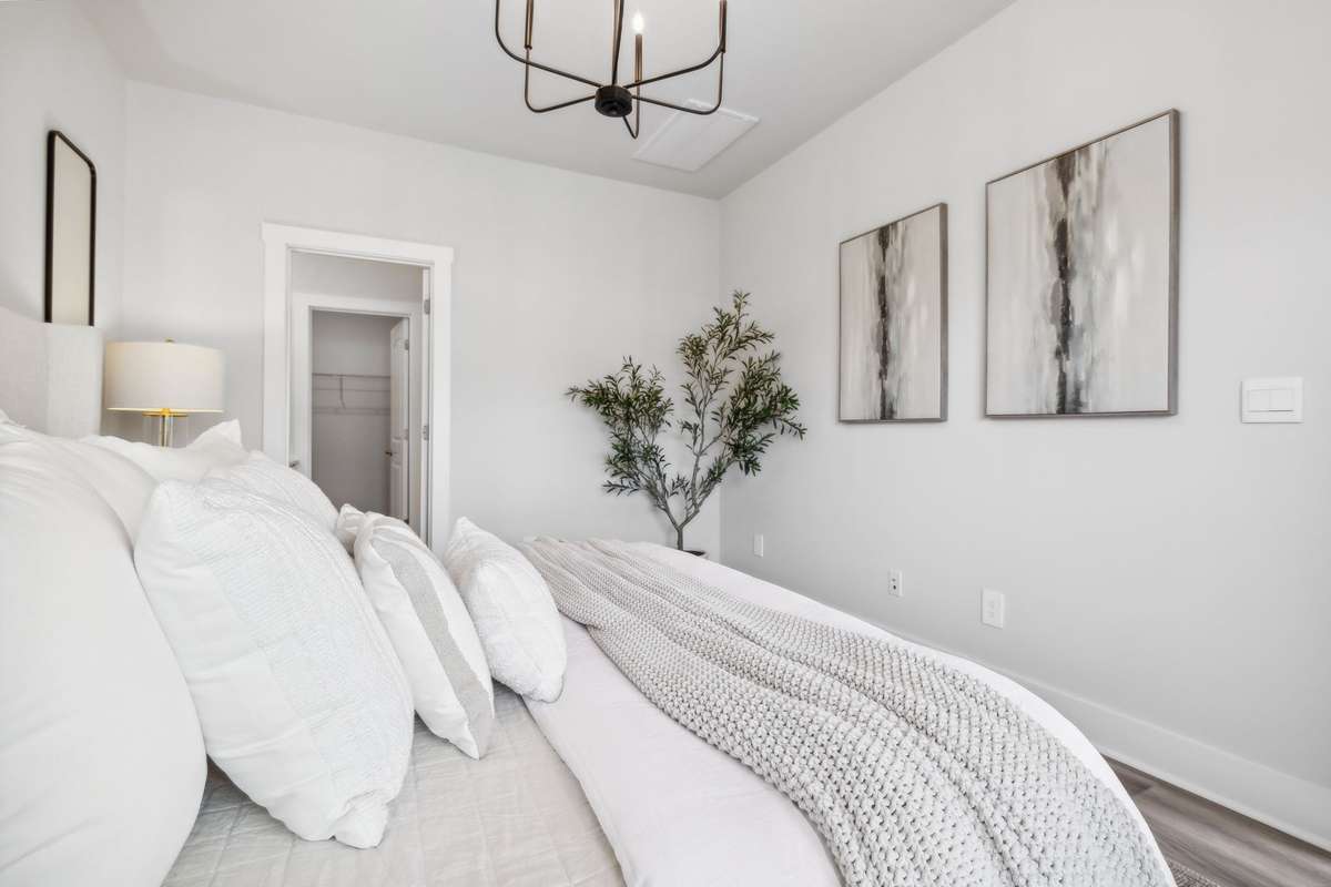 Photo of similar home in the same community - primary on the main level with one car garage. Upgrades available. Closing cost assistance available. Contact the onsite agent - model home open Wednesday-Saturday 10-5 and Sunday 1-5.
