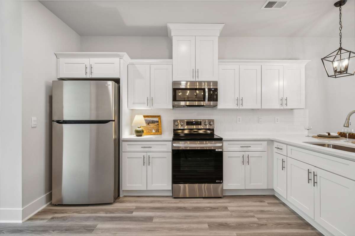 Photo of similar home in the same community - primary on the main level with one car garage. Upgrades available. Closing cost assistance available. Contact the onsite agent - model home open Wednesday-Saturday 10-5 and Sunday 1-5.