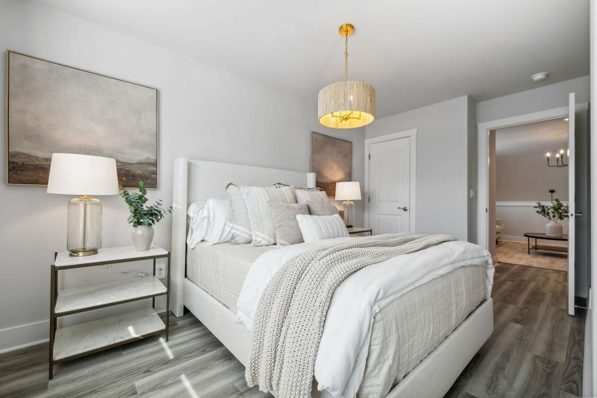 Photo of similar home in the same community - primary on the main level with one car garage. Upgrades available. Closing cost assistance available. Contact the onsite agent - model home open Wednesday-Saturday 10-5 and Sunday 1-5.