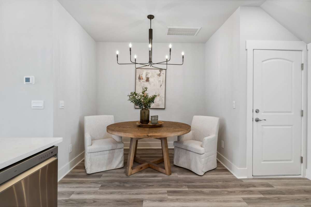 Photo of similar home in the same community - primary on the main level with one car garage. Upgrades available. Closing cost assistance available. Contact the onsite agent - model home open Wednesday-Saturday 10-5 and Sunday 1-5.