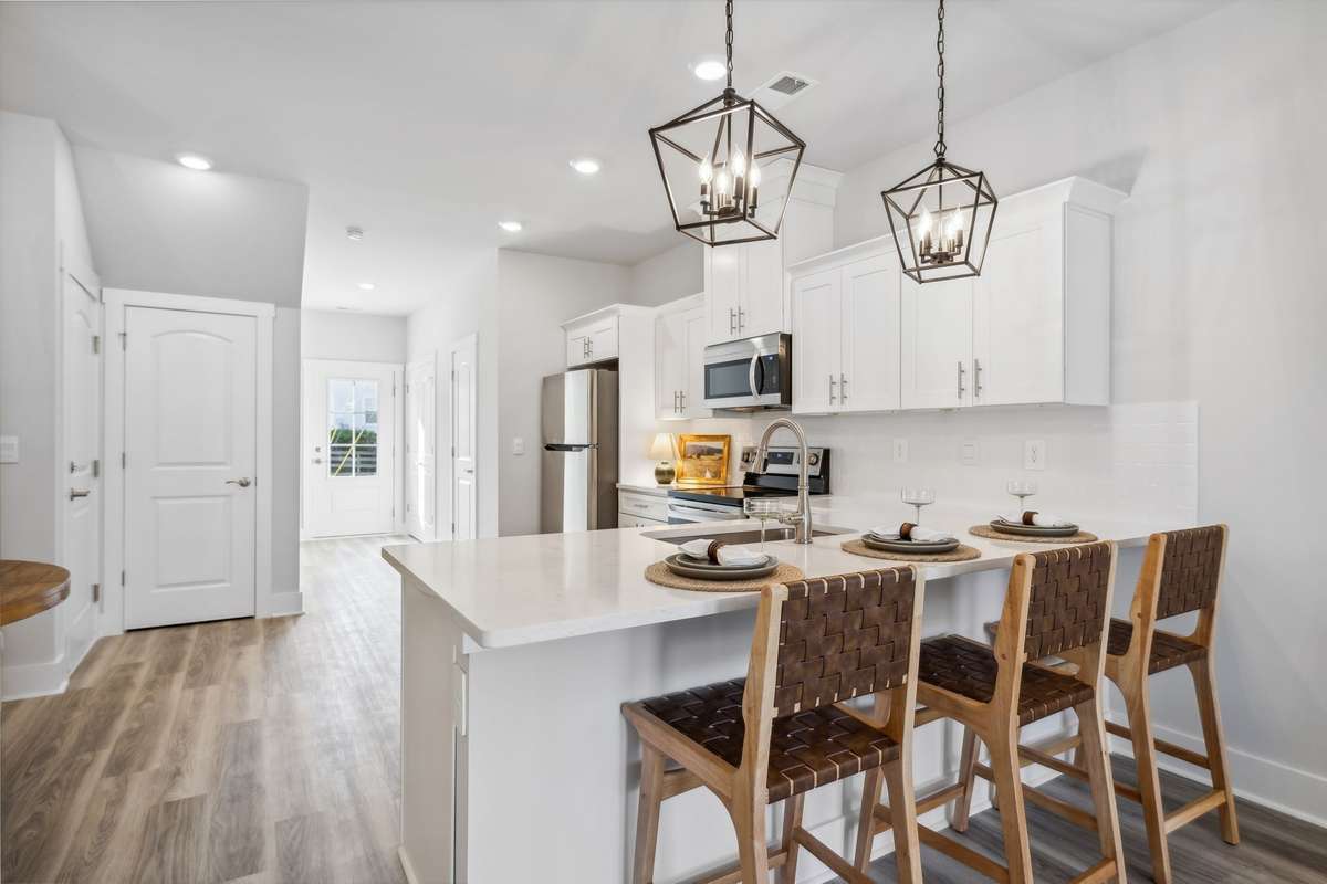 Photo of similar home in the same community - primary on the main level with one car garage. Upgrades available. Closing cost assistance available. Contact the onsite agent - model home open Wednesday-Saturday 10-5 and Sunday 1-5.