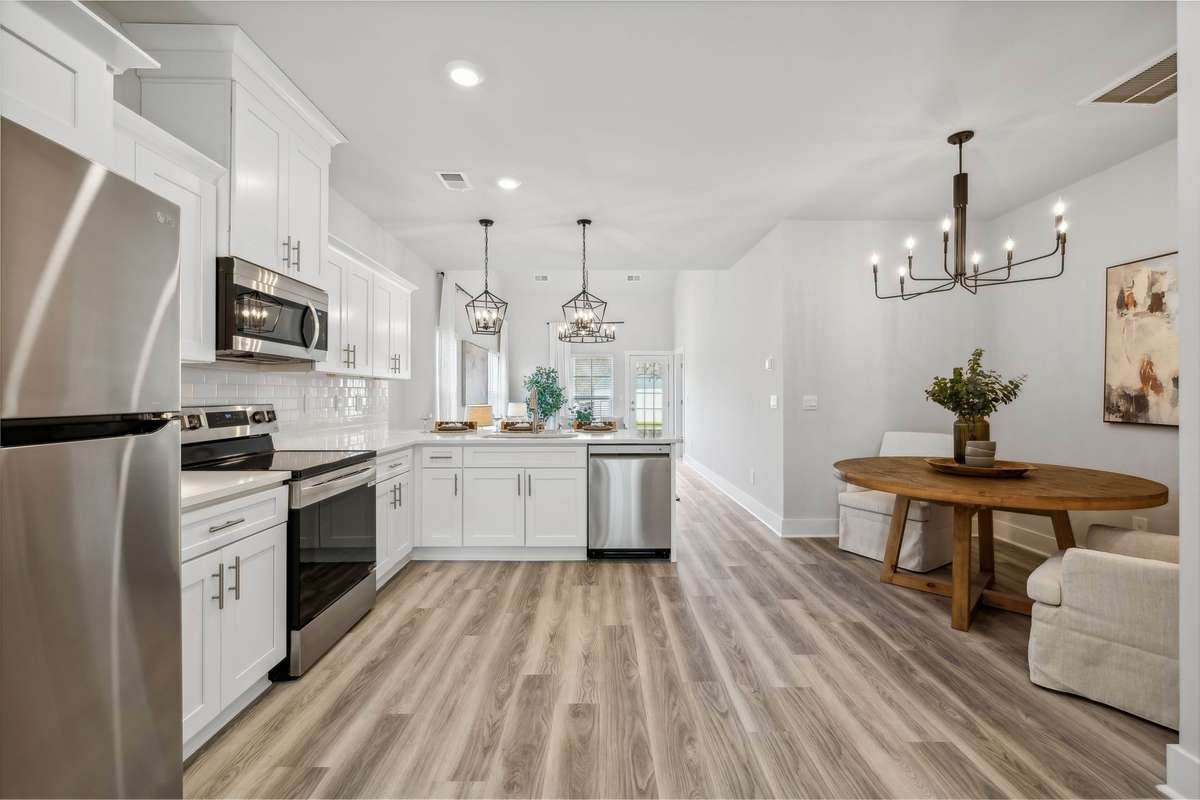 Photo of similar home in the same community - primary on the main level with one car garage. Upgrades available. Closing cost assistance available. Contact the onsite agent - model home open Wednesday-Saturday 10-5 and Sunday 1-5.