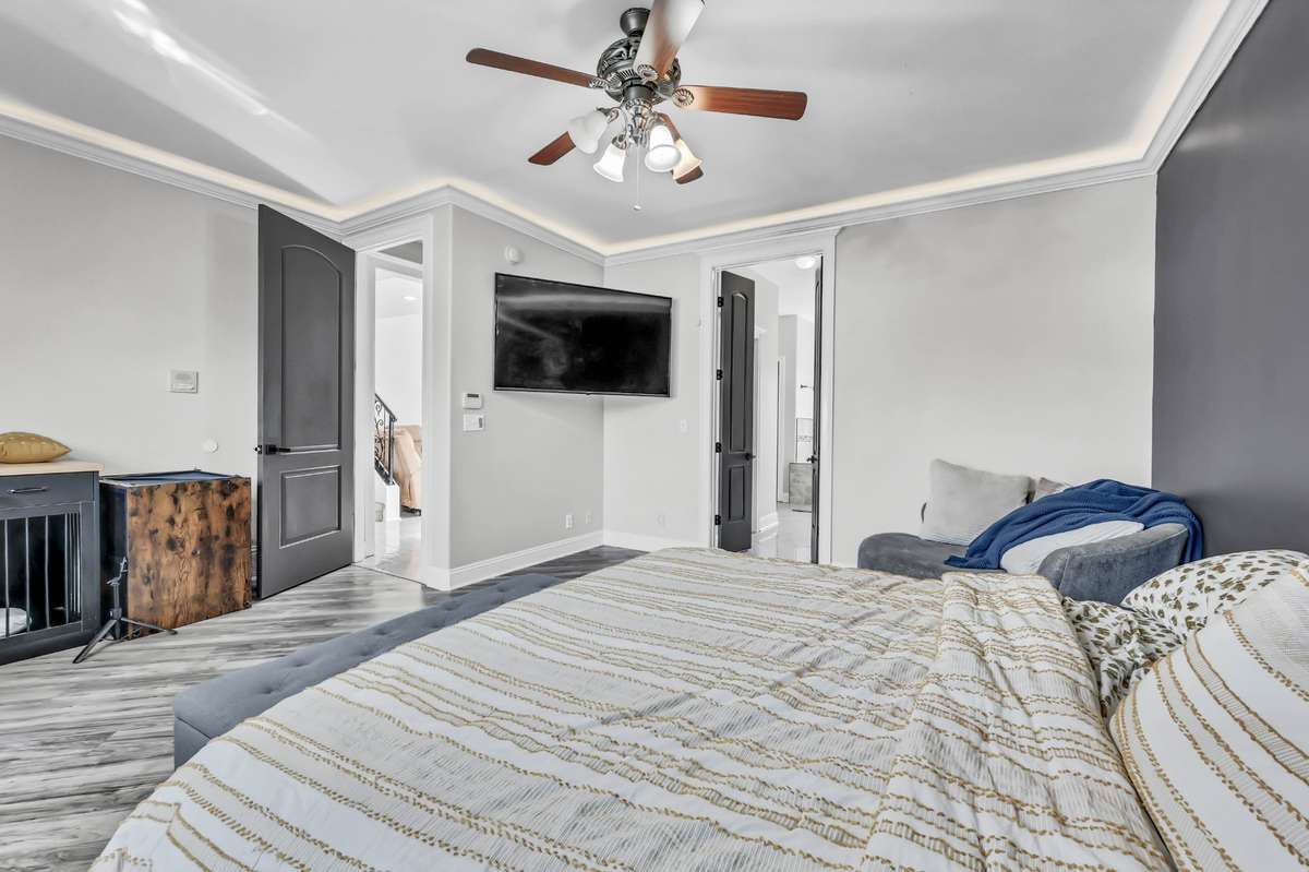 The primary is spacious & features accent lighting.