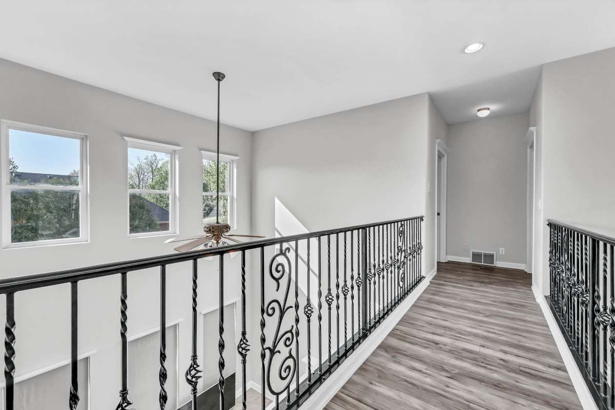 Walk down the catwalk & find bedroom 4 + office/storage room.