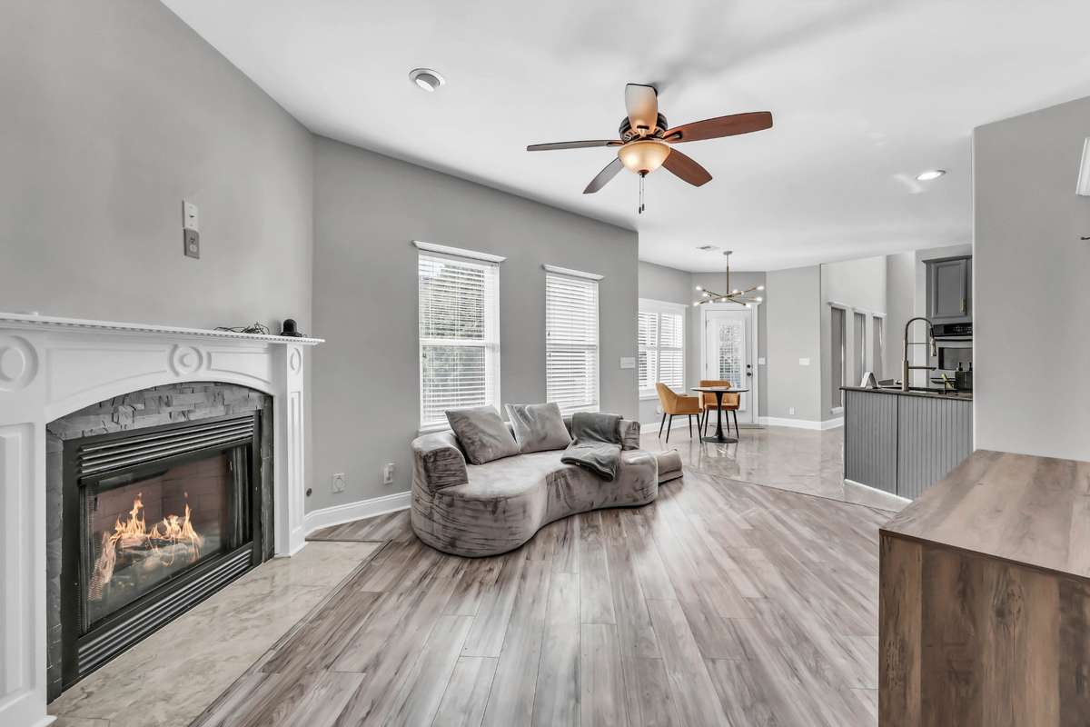 Gas fireplace + natural light completes the den area.