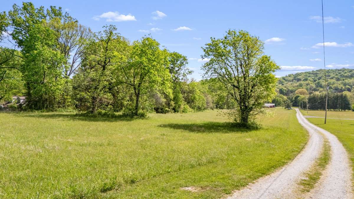 A private country drive leading you home—peace, space, and Tennessee charm from the moment you arrive.