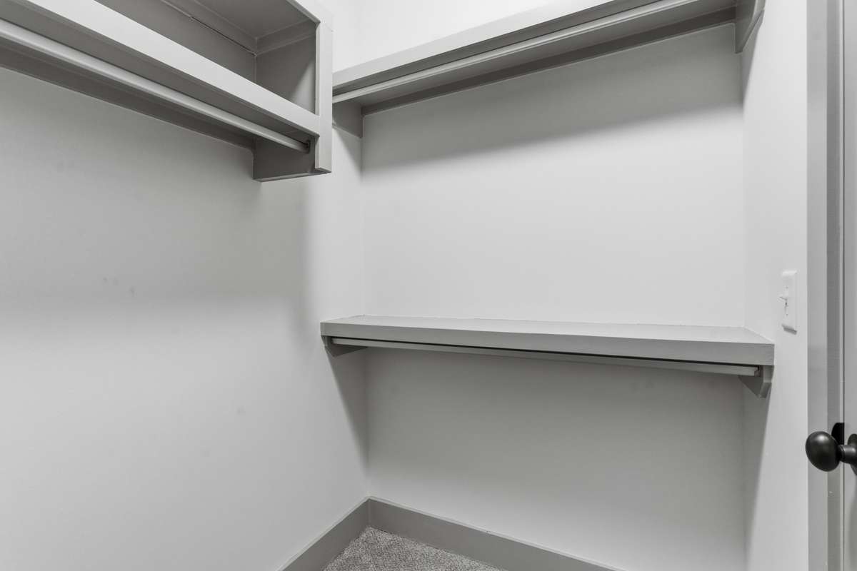 Primary bedroom walk-in closet