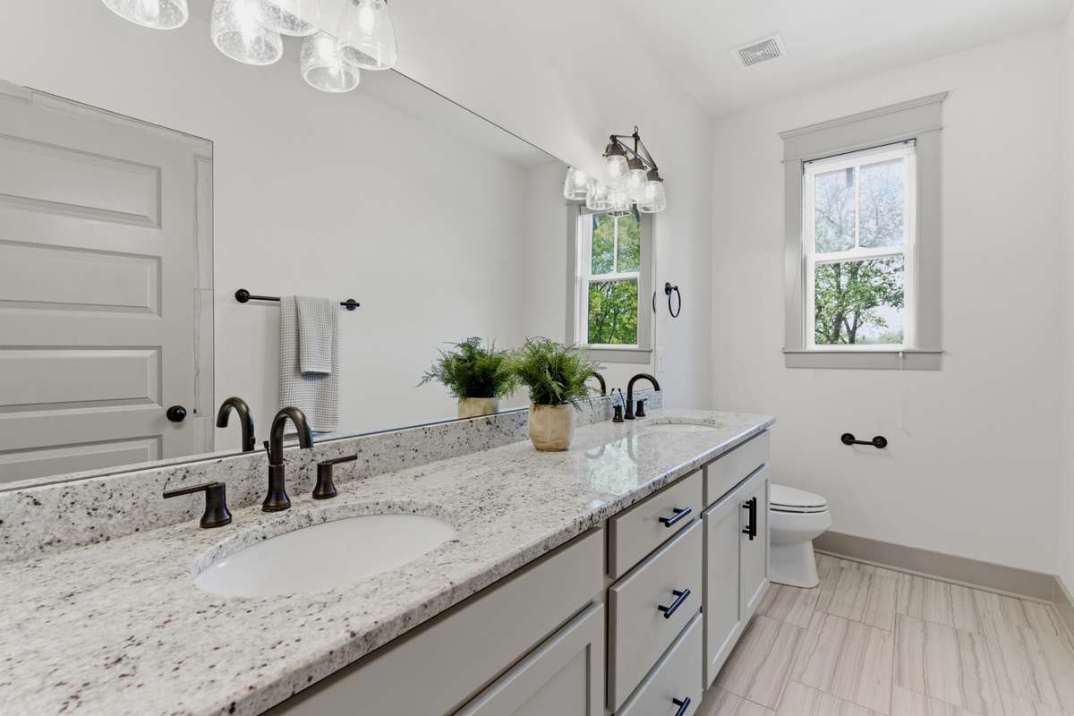 Double vanities in primary suite bathroom