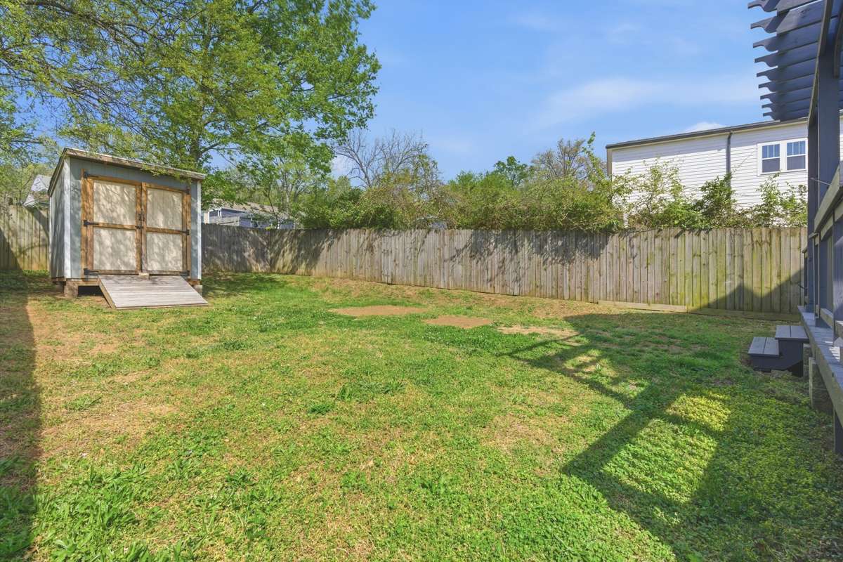 Includes fenced in back yard with storage shed