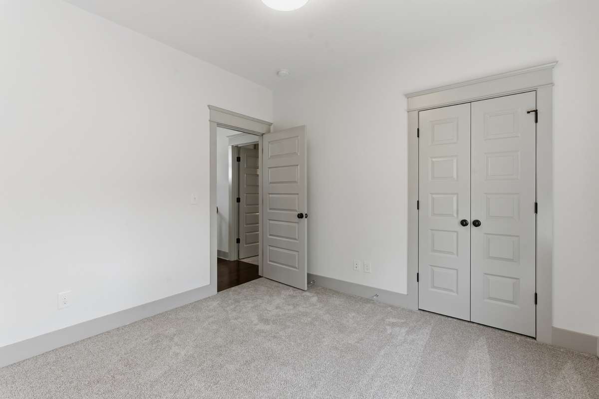 Upstairs third bedroom with new carpet and connecting full bath