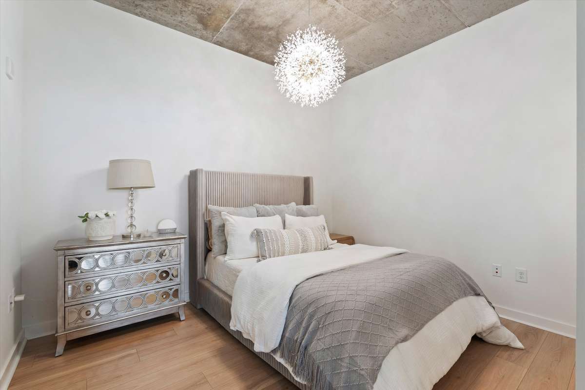 Spacious bedroom with gorgeous chandalier